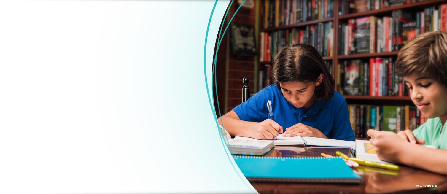 Two boys doing homework in a library